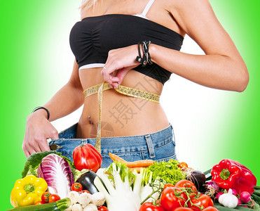 食物饮概念一个测量体重的瘦弱女孩图片
