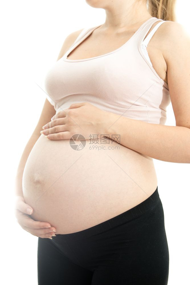 白孤立背景孕妇的大肚子图片