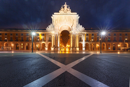 梅萨拱门晚上在葡萄牙里斯本商业广场Ttriumphal拱门RuaAugustaArch晚上在葡萄牙里斯本商业广场背景