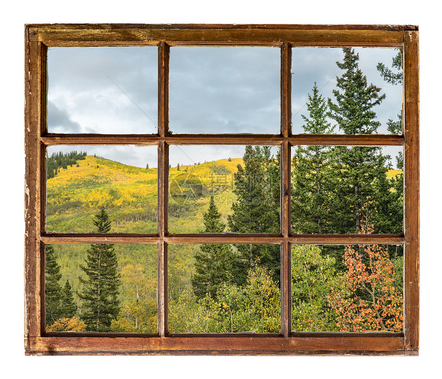 科罗拉多洛基山的落颜色从古老的坚固用脏玻璃砸碎的窗户中图片