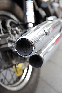 摩托车特写摩托车的铬排气管浅体DF背景