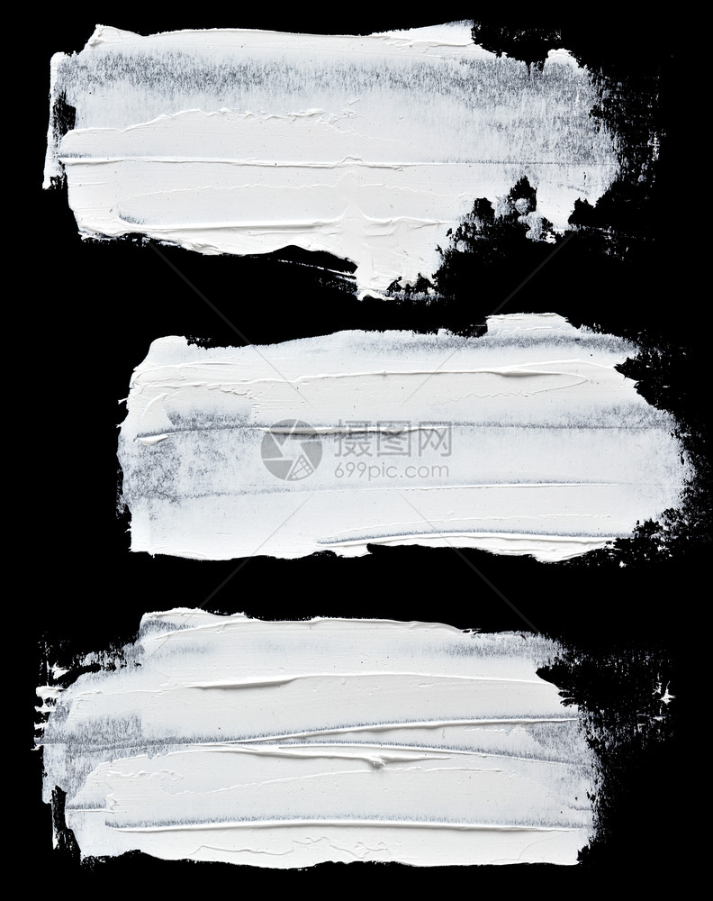 在黑色背景上隔离的一组白油漆笔图片