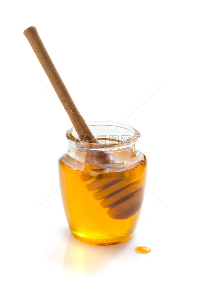 在白色背景上隔离的蜂蜜和顶层玻璃罐图片