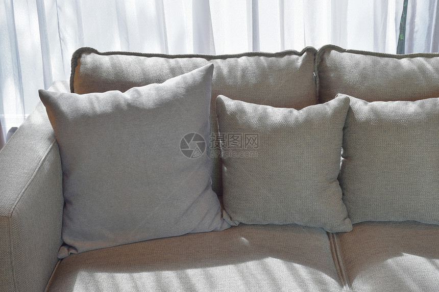 灰色枕头和阴影的灰色枕头贴近图像图片