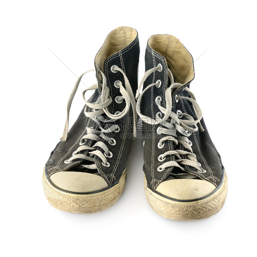 白色背景的旧式运动鞋被隔离在白色背景图片