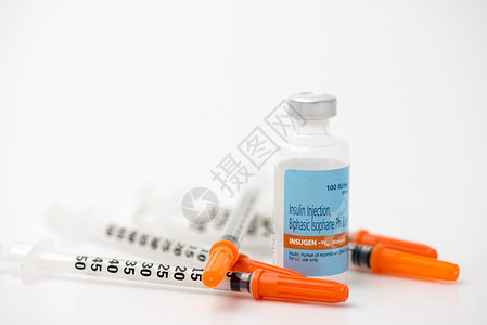 含注射器谎言的胰岛素安眠药背景图片
