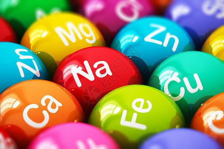 钙元素创造抽象健康生活方式饮食健康和营养品概念有选择焦点效应的色球药丸或配有矿物和微量元素名称的片或色球宏观点背景