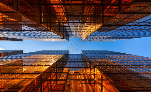 蓝色的金建筑现代办公摩天大楼的窗玻璃外观设计城市景色背的建筑外观图片