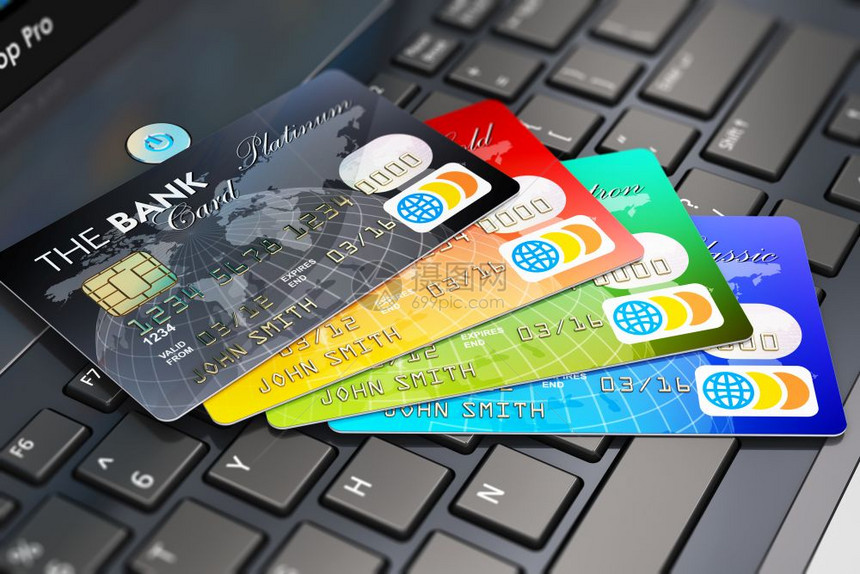 创意抽象互联网银行会计和上购物络概念对笔记本电脑或键盘上的彩色信用卡组合的宏观点有选择焦点效果图片