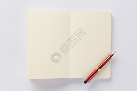 红色文案白背景顶视图上的笔记本或背景