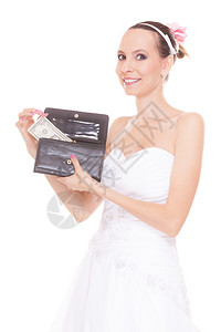 带着1美元和钱包的新娘持有钱包和现金的年轻女孩结婚费用支出姻和金融概念穿着白色婚纱的妇女孤立在白色背景上带1美元的妇女新娘结婚费背景图片