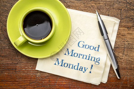 星期一早上好餐巾纸上写着的笔迹加上一杯咖啡图片
