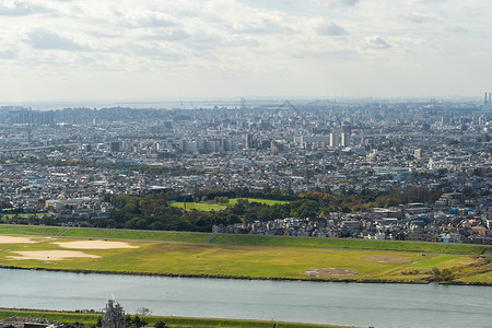 东京公寓在市景背中的空象亚洲智能城市住宅区有河流中午的建筑物图片