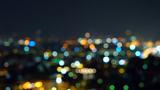 城市的摩天大楼布基灯光照亮夜里闪的照片图片