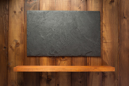 黑色笛架子木背景纹理上的石板背景
