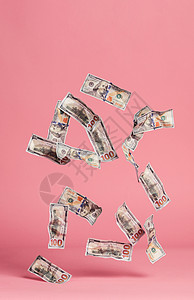 飞钱钞票在粉红色背景上下跌货币和金融经济美元钞票在粉红色背景上下跌背景