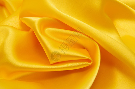黄色窗帘平滑优雅的金丝绸可用作背景背景