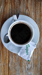 木桌背景上传统巴厘咖啡杯高清图片