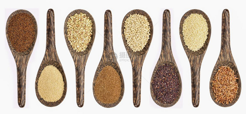 零谷类从左边卡尼瓦阿马拉特小麦塔夫高梁黑quinoa小米和棕在白色上隔离的木勺图片