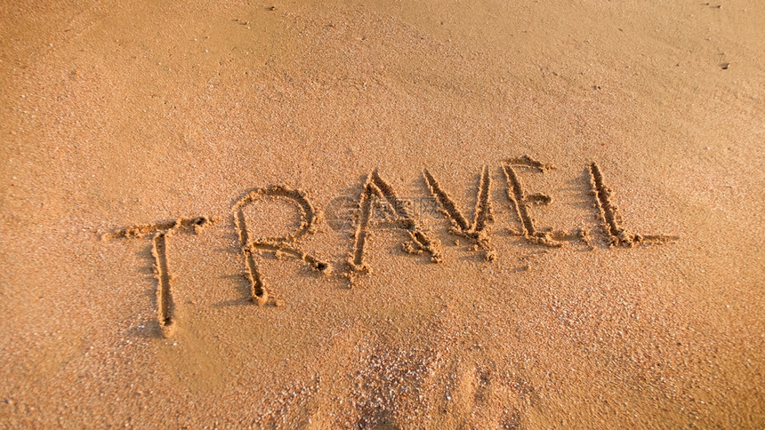 旅游在海滩沙上标记旅游行和的概念游行和的概念图片