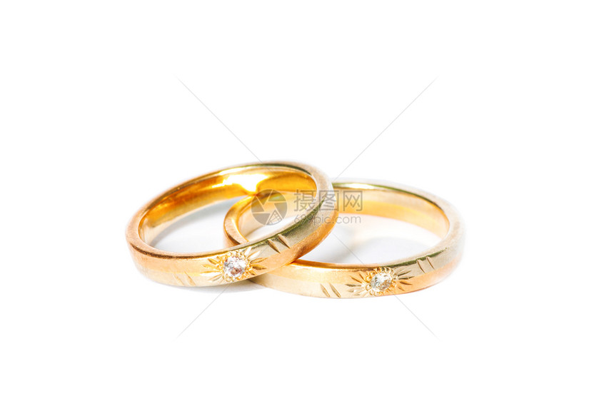 两个金结婚戒指孤立在白色的结婚戒指背景概念图片