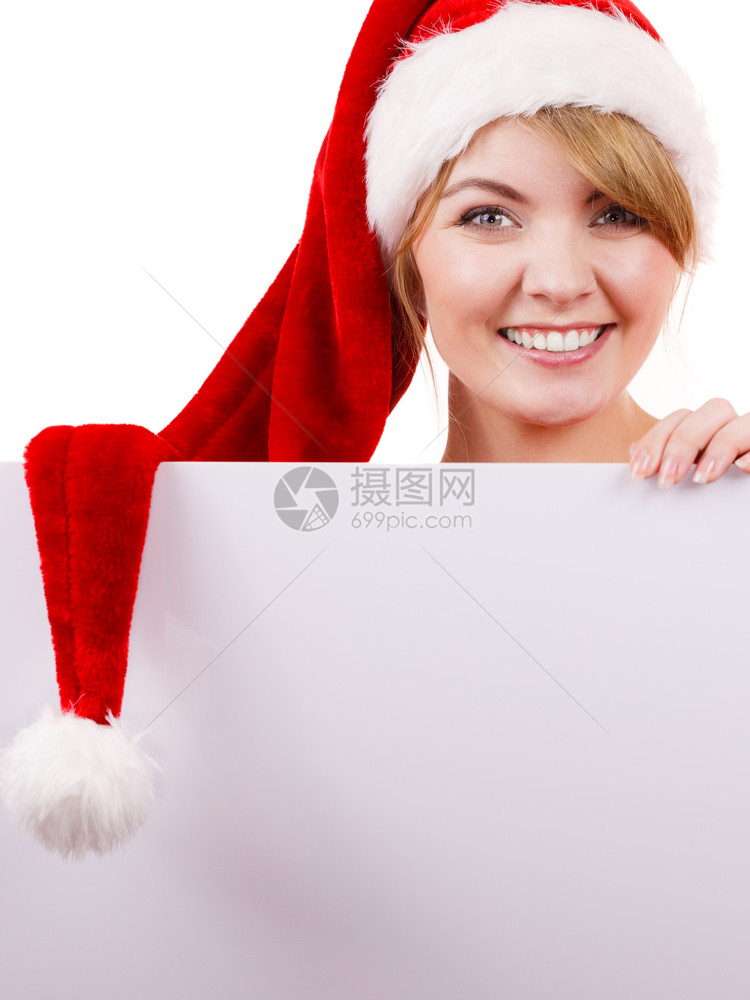 穿着圣达克萨斯帮手帽子的快乐女孩圣诞广告复制空间图片