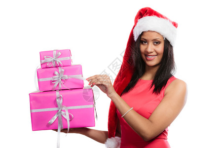 身着红礼服圣塔帮手帽子拿着一堆粉红礼物的白人女孩混合种族子图片