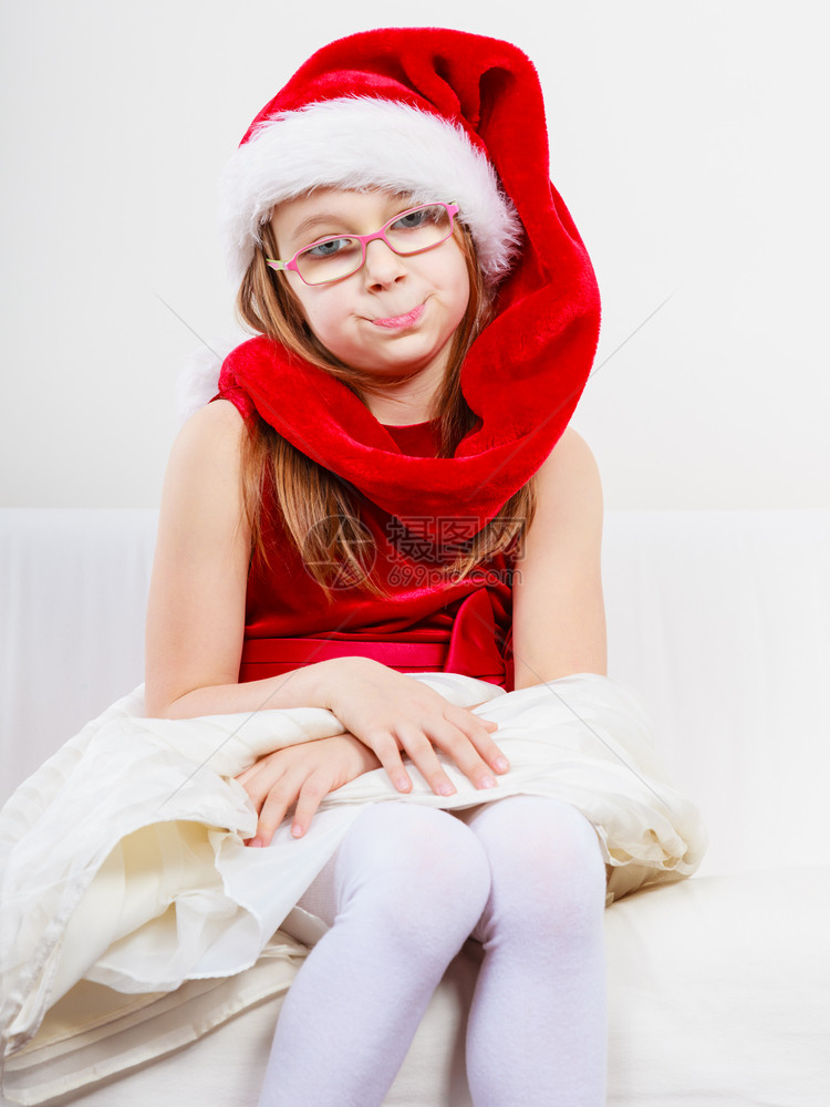 穿着圣诞帽子的托德勒女孩穿着圣诞帽子和礼服的托德勒女孩图片