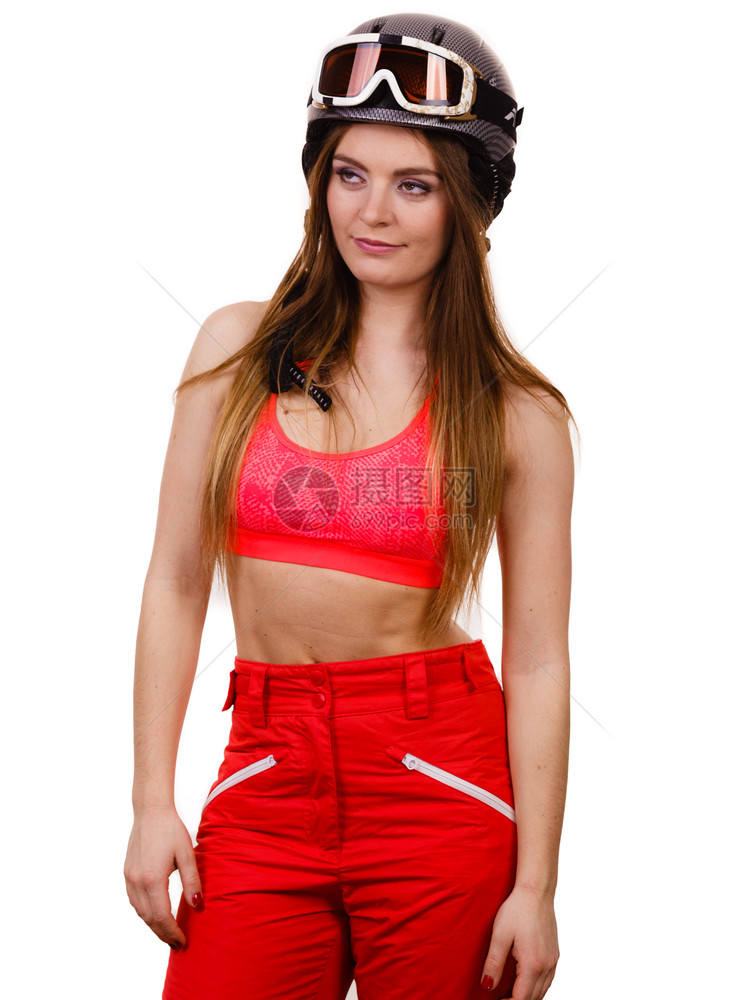 冬季运动者的概念头盔的强壮女人穿红衣的年轻女士图片