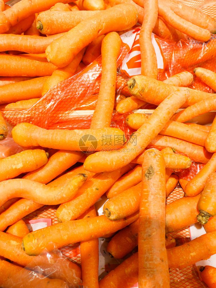 健康蔬菜有机新鲜食品概念闭合多堆橙胡萝卜图片
