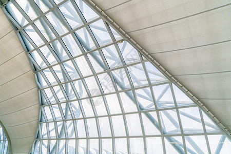 支持现代办公楼顶的钢铁结构金属窗玻璃外墙框架简易内部建筑设计装饰背景背景图片