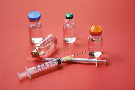 拒绝毒疫苗红底注射针药用瓶装设备护士或医生疗工具背景