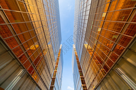 Golden建筑现代办公大楼的玻璃窗技术和商业概念方面的现代办公摩天大楼外观设计建筑或工程结构城市背景外观背景