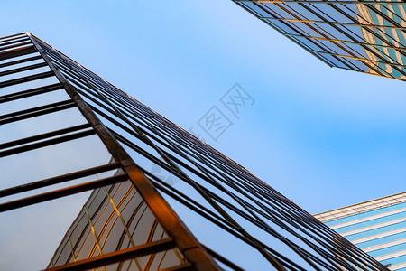 Golden建筑现代办公大楼的玻璃窗技术和商业概念方面的现代办公摩天大楼外观设计建筑或工程结构城市背景外观背景图片