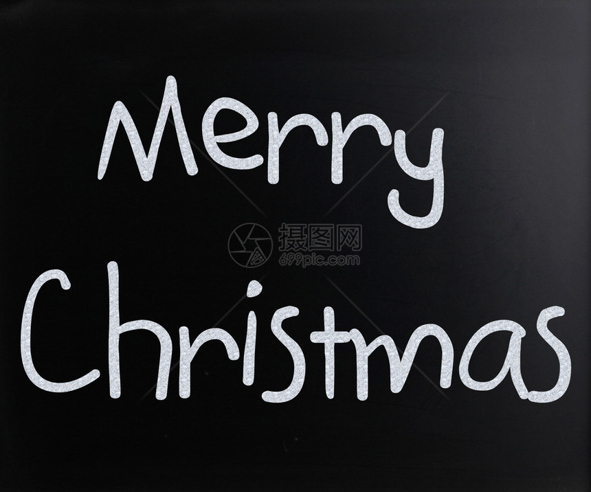 圣诞快乐手写白色粉笔在黑板上图片
