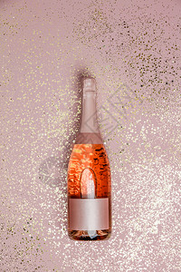 盛装香槟粉红背景的金光亮顶级风景令人欢笑的庆典图片