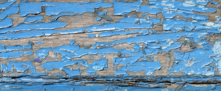 涂有蓝色底漆的旧碎木板条纹理图片