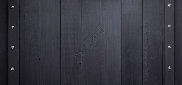 黑色木背景作为带有螺丝的纹理表面高清图片