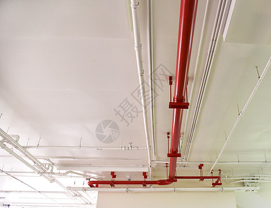 红自来水管道消防设备安装混凝土的金属水管道系统背景图片