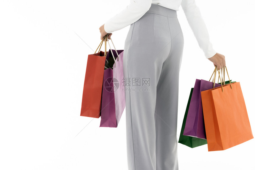 穿着购物袋的快乐女的近视低段和背影工作室在白色背景上拍摄用于销售消费主义和购物概念图片