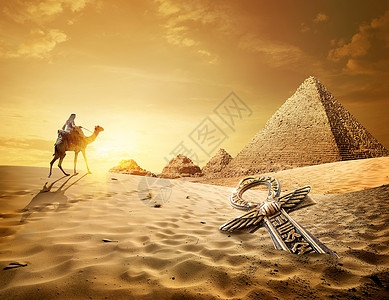 在金字塔附近和沙漠中安赫附近骑骆驼的贝都因人背景图片
