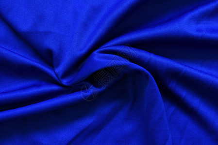黑蓝纸质布背景平滑优雅的蓝丝绸图片