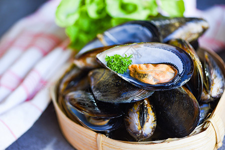 蒸汽海鲜素材烹饪蒸汽机食品背景餐厅的贝壳鱼背景