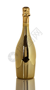 新年快乐金香槟酒瓶孤立在白色背景和反光的白色背景上高清图片
