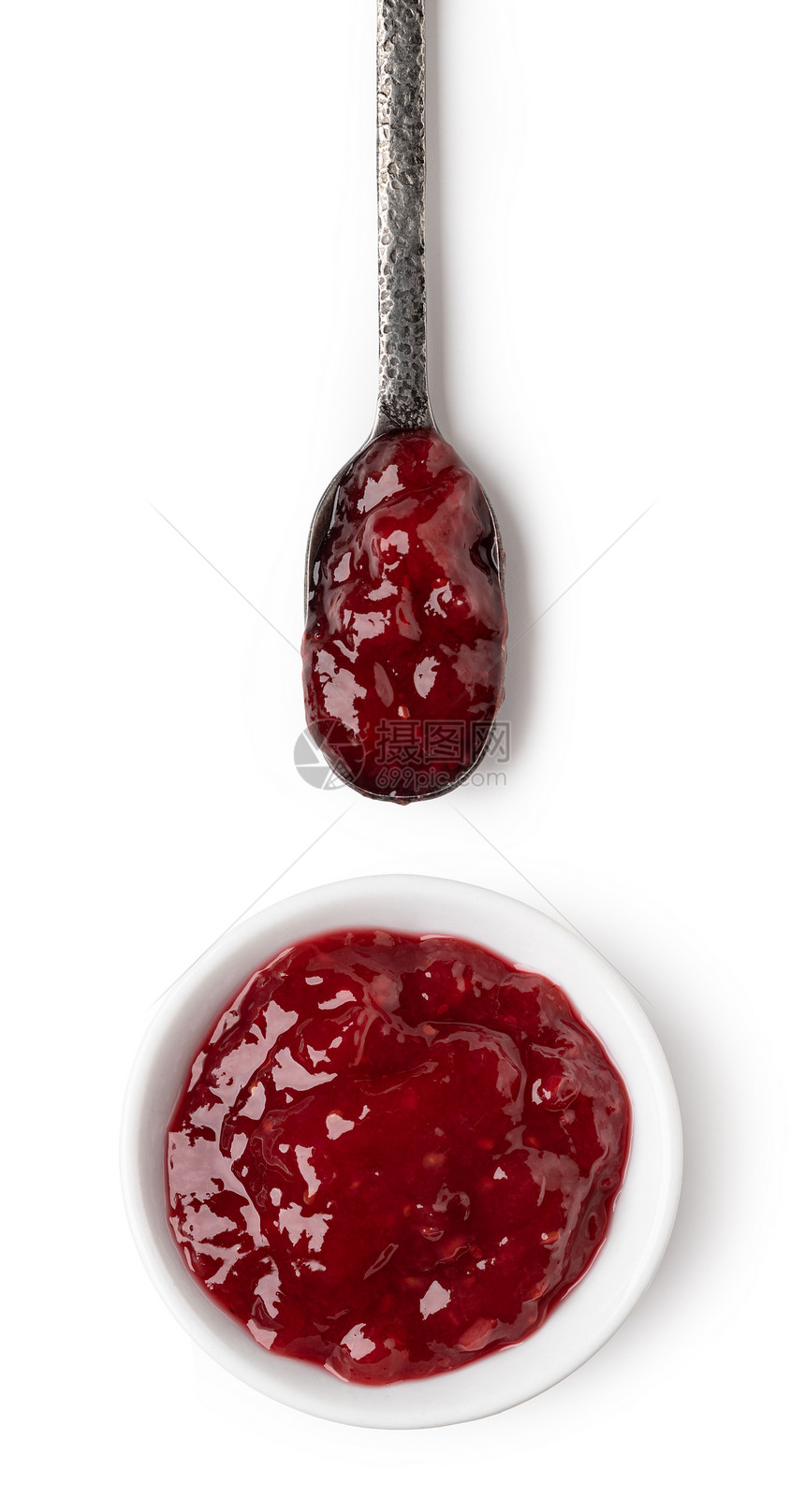 小玻璃碗和一勺红莓果酱图片