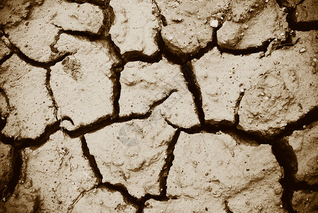 干旱季节土壤燥的裂口碎和粗地表泥土顶视图图片