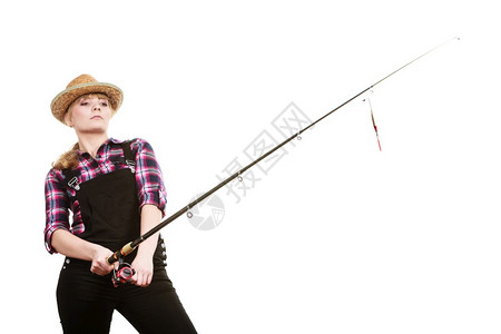 戴太阳帽的专注妇女拿着钓鱼棒和钩打架戴太阳帽的专注妇女拿着钓鱼棒图片