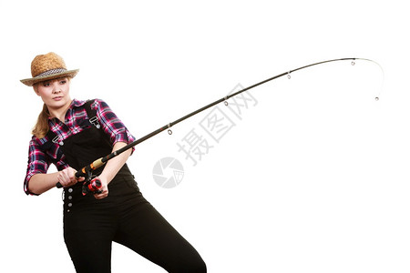 戴太阳帽的专注妇女拿着钓鱼棒和钩打架戴太阳帽的专注妇女拿着钓鱼棒图片