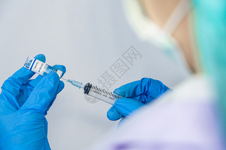腮腺炎医生、科学家研究人员手戴蓝套或防护服,准备进行人类临床注射试验背景