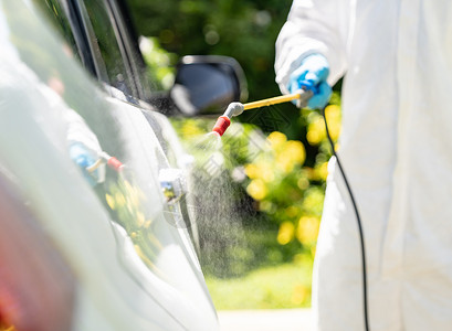 汽车净化专门清洁人员穿戴个防护设备PPE新的正常卫生概念背景